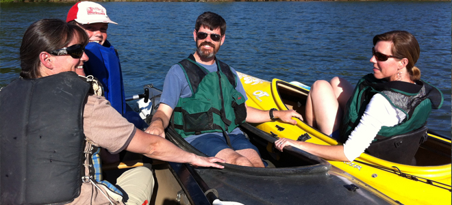 Paddlers chatting on lake
